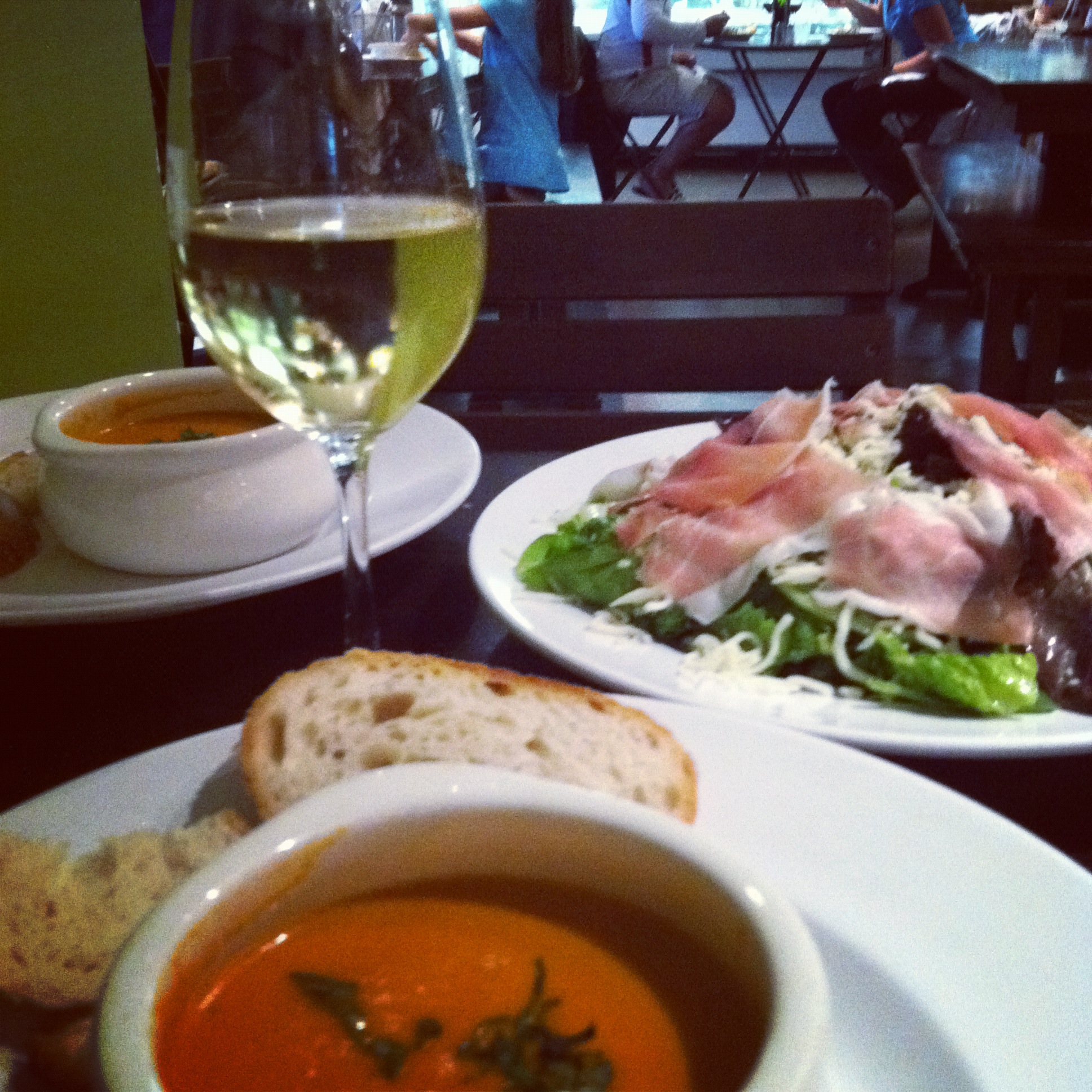 Breaking bread at one of the Kitchen Tables that meet weekly at The Table